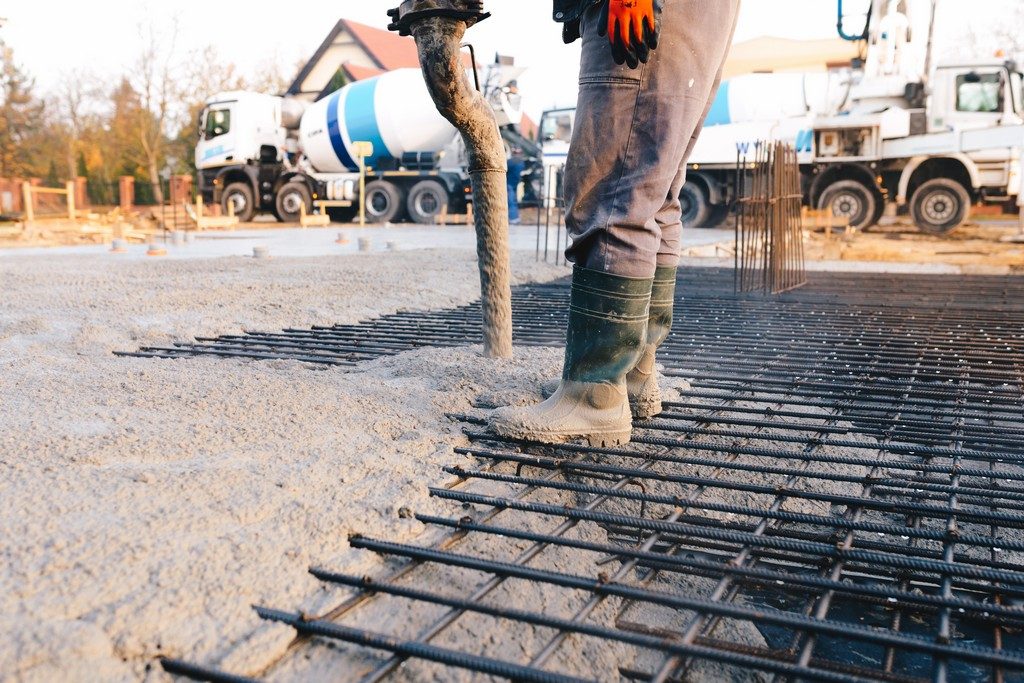 Concrete worker laying a foundation for a business in Queen Creek